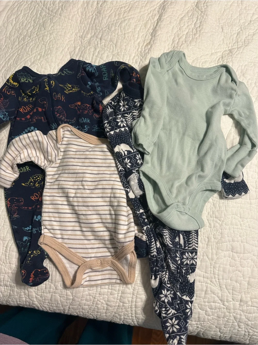 0287 4 piece set of footed PJs and onesies size 0-3 and newborn